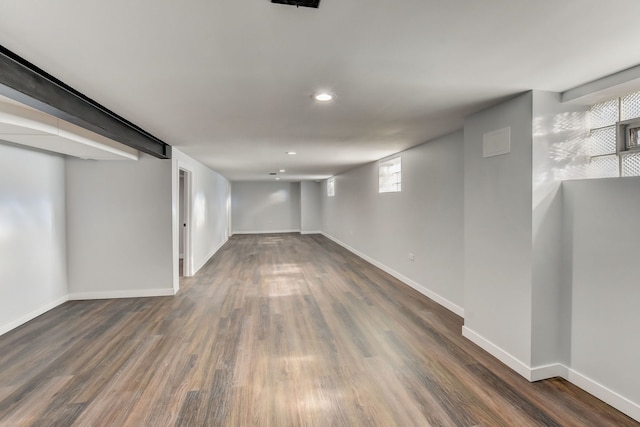 basement featuring dark hardwood / wood-style flooring