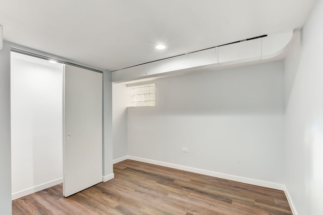 interior space with a closet and hardwood / wood-style floors