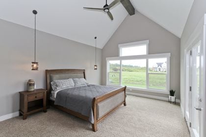 bedroom with ceiling fan, high vaulted ceiling, beam ceiling, and carpet floors