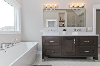 bathroom featuring shower with separate bathtub and vanity