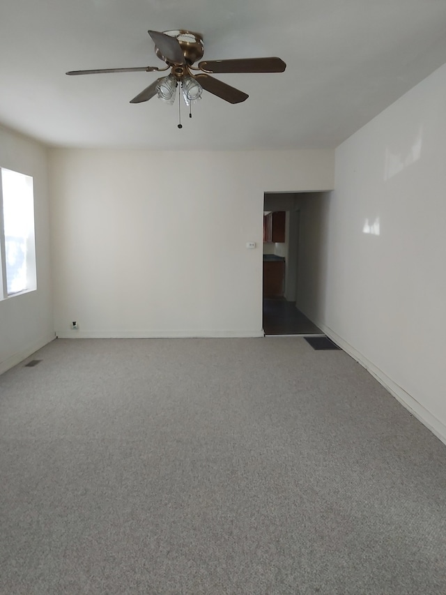 carpeted empty room with ceiling fan