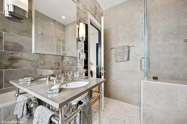 bathroom with tile walls and large vanity