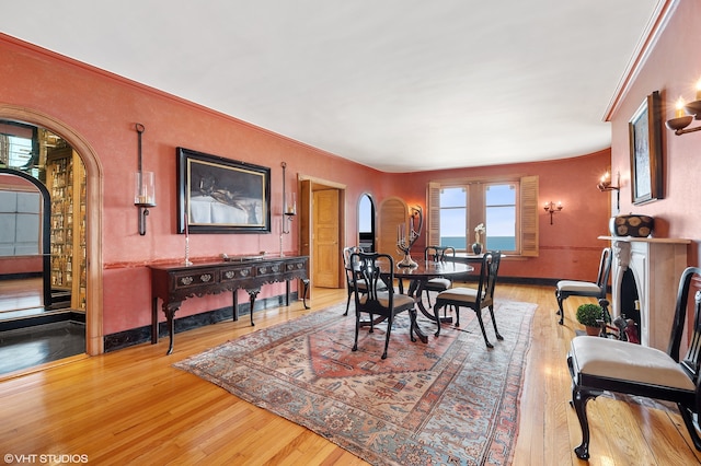 dining area with french doors and light hardwood / wood-style floors