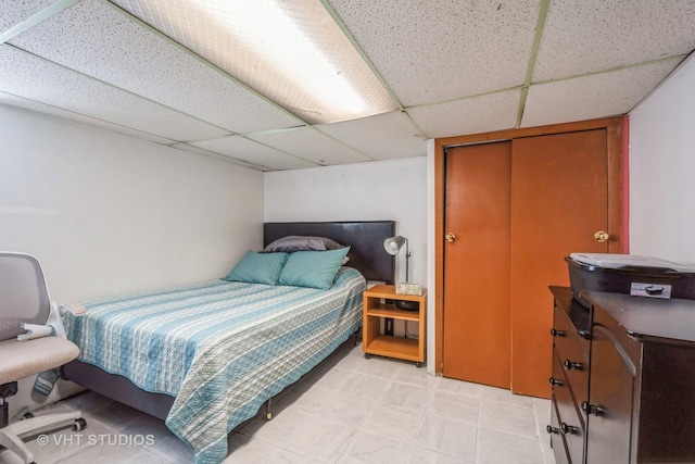 bedroom with a drop ceiling