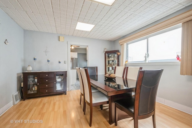 dining space featuring light hardwood / wood-style flooring