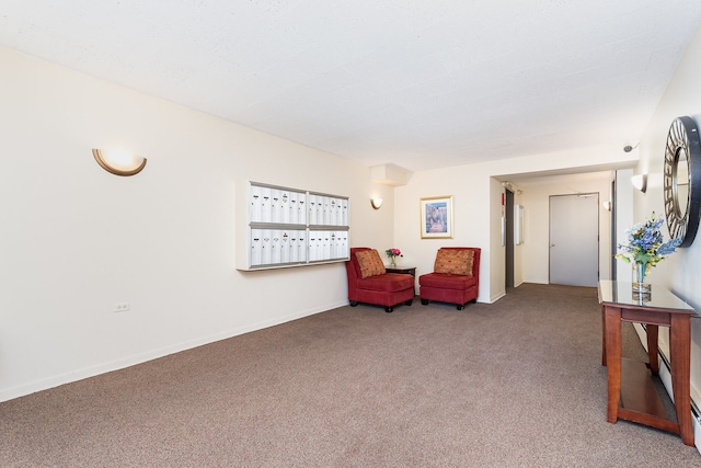 sitting room featuring dark colored carpet