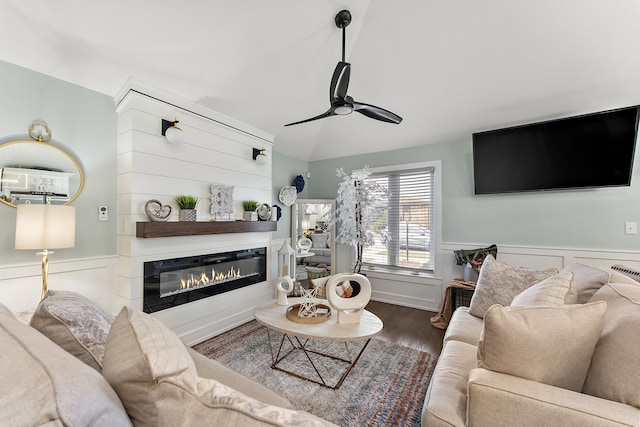 living room with ceiling fan and hardwood / wood-style flooring