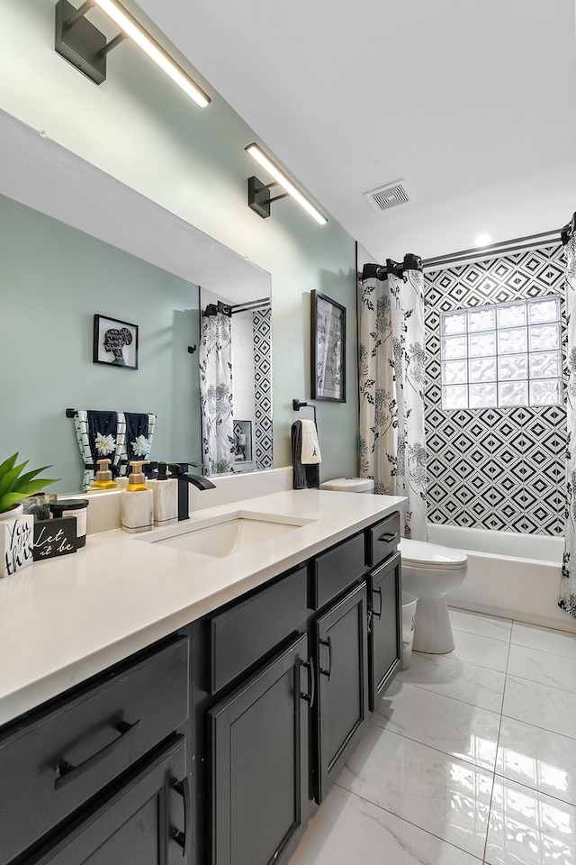 full bathroom featuring tile flooring, shower / bath combo with shower curtain, toilet, and vanity