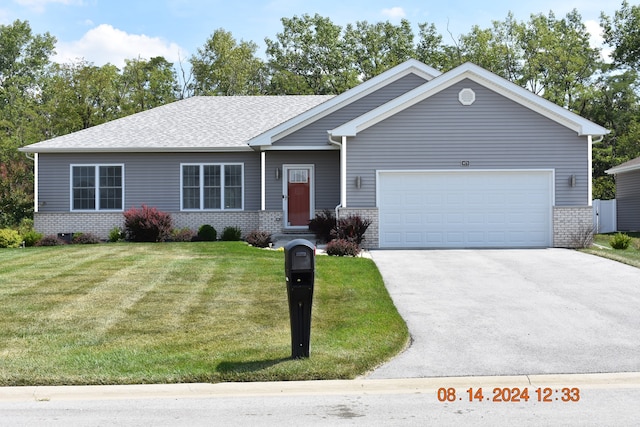 ranch-style house with a garage and a front yard