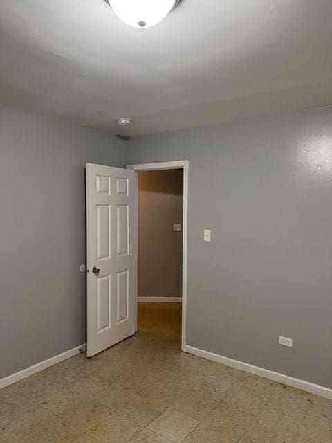 spare room with light tile floors