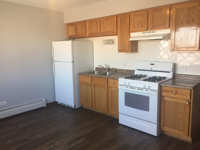 kitchen with white appliances, sink, baseboard heating, tasteful backsplash, and dark hardwood / wood-style flooring