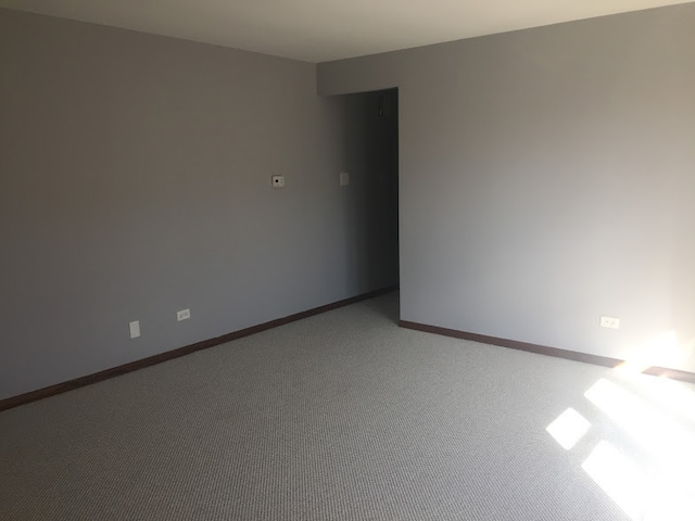 empty room featuring light colored carpet