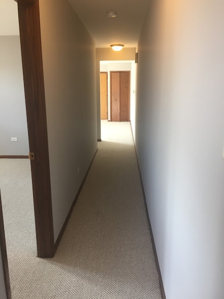 hallway with light carpet