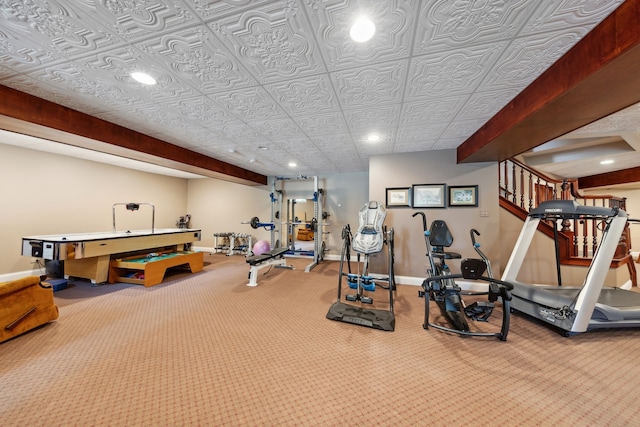 exercise area featuring light colored carpet