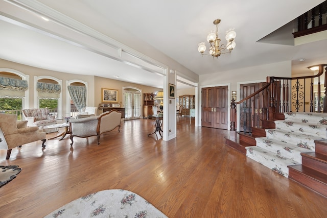 foyer with an inviting chandelier and light wood-type flooring