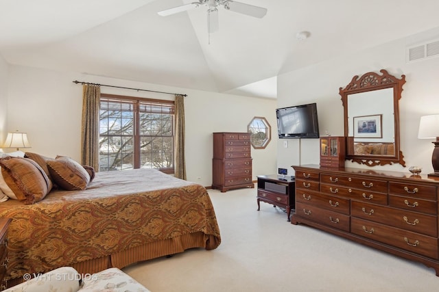 bedroom with lofted ceiling, light colored carpet, and ceiling fan