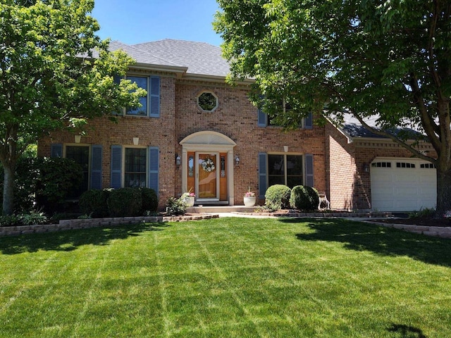 colonial house with a front lawn and a garage