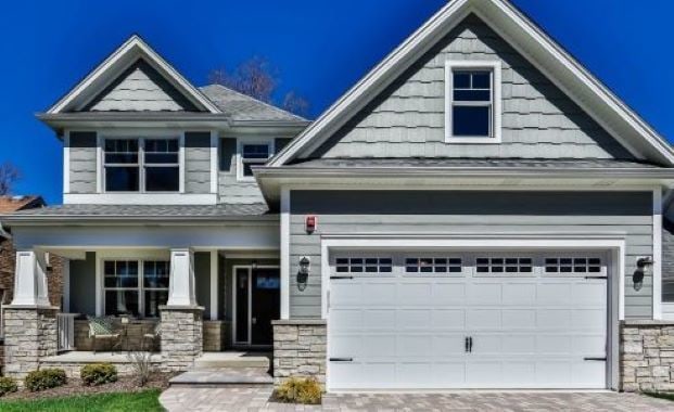 craftsman-style house with covered porch and a garage