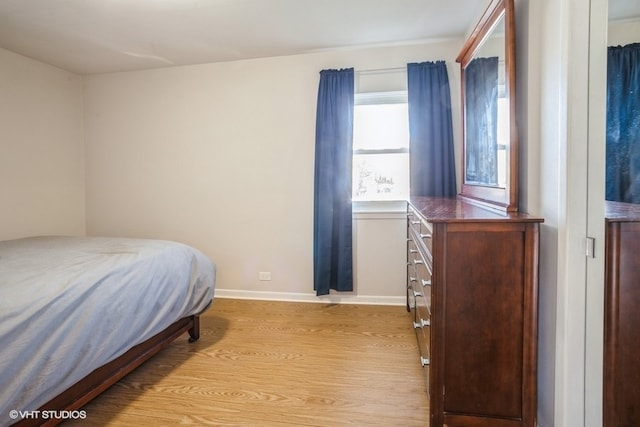 bedroom with light hardwood / wood-style floors