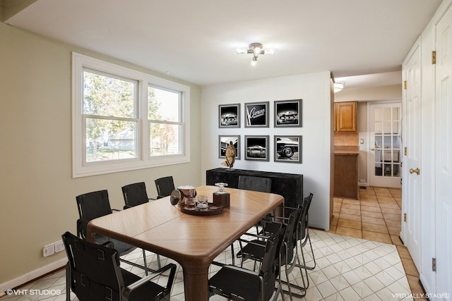 dining area featuring light tile patterned floors