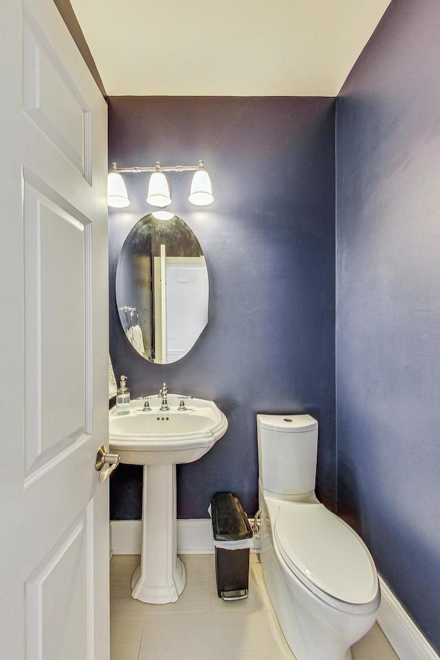 bathroom featuring tile patterned flooring and toilet