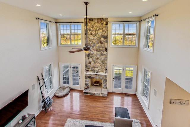 living room with french doors, hardwood / wood-style flooring, plenty of natural light, and ceiling fan