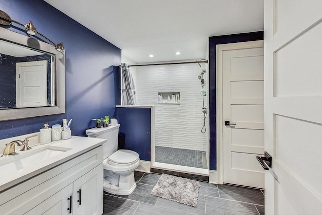 bathroom featuring vanity, curtained shower, and toilet