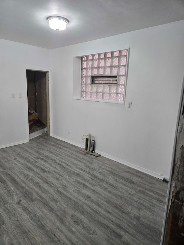 spare room featuring dark hardwood / wood-style floors