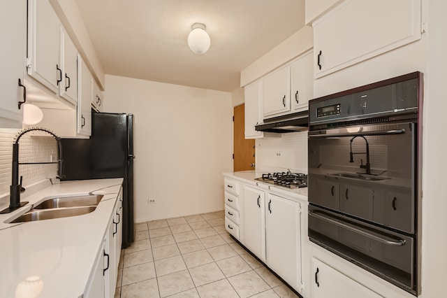 kitchen featuring white cabinetry, black double oven, sink, light tile floors, and gas cooktop