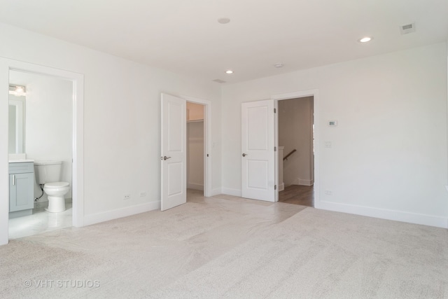 unfurnished room with light carpet