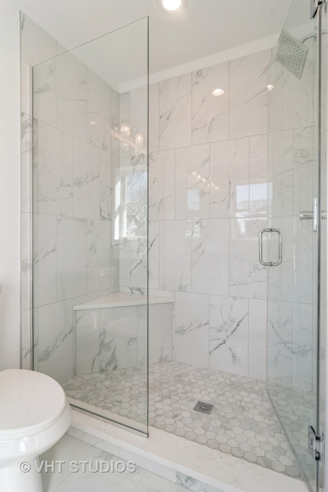 bathroom with an enclosed shower, toilet, and tile floors