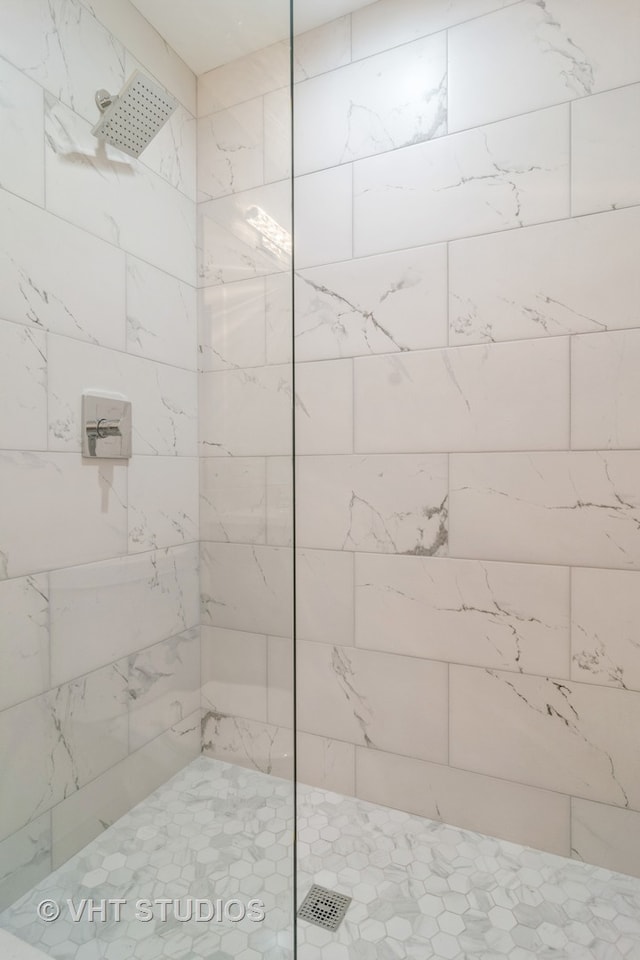 bathroom with a tile shower