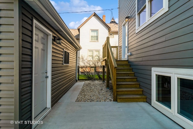 view of side of home featuring a patio area