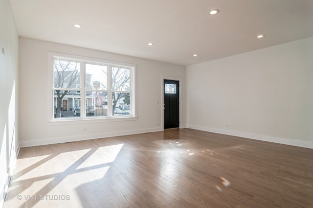 spare room featuring hardwood / wood-style flooring