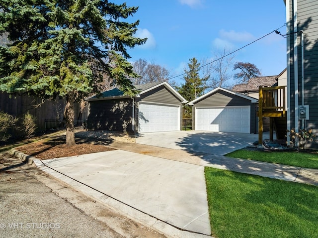 view of front facade featuring an outdoor structure and a garage