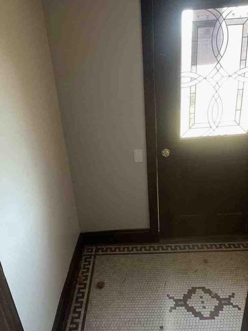 doorway with tile floors