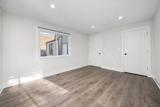 empty room featuring dark hardwood / wood-style floors