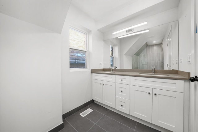 bathroom featuring double sink, tile flooring, and large vanity