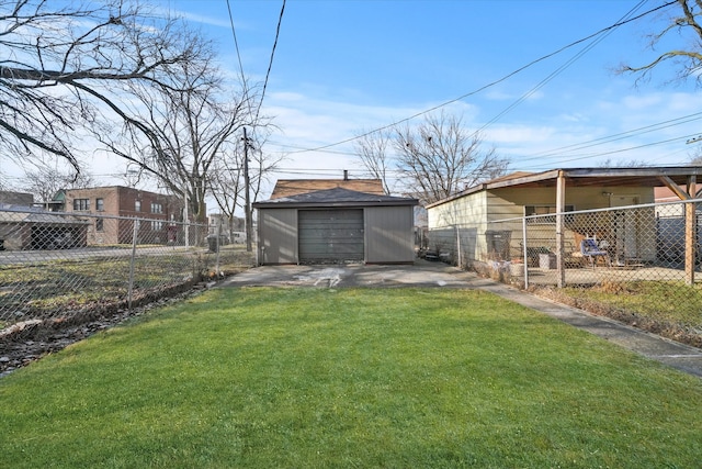 view of yard featuring an outdoor structure and a garage