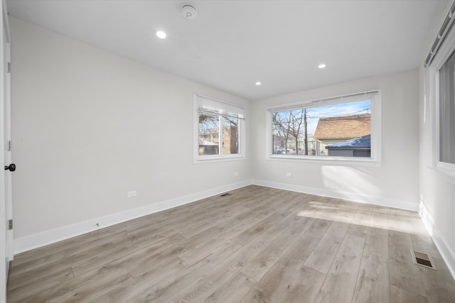 unfurnished room featuring light hardwood / wood-style flooring