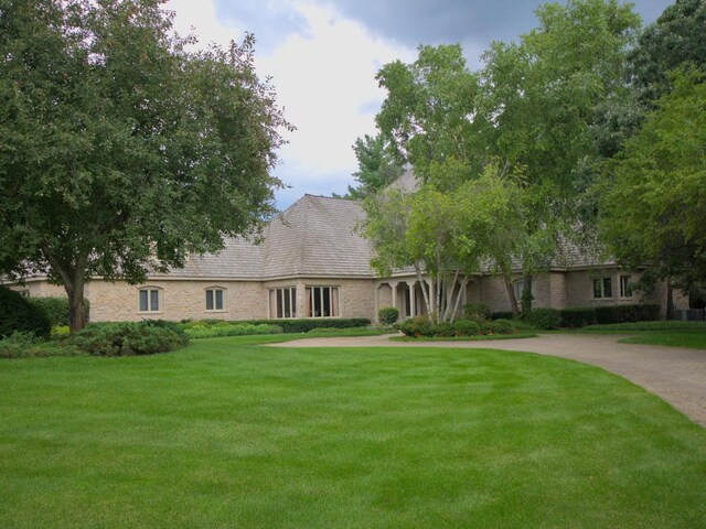 view of front of home with a front lawn