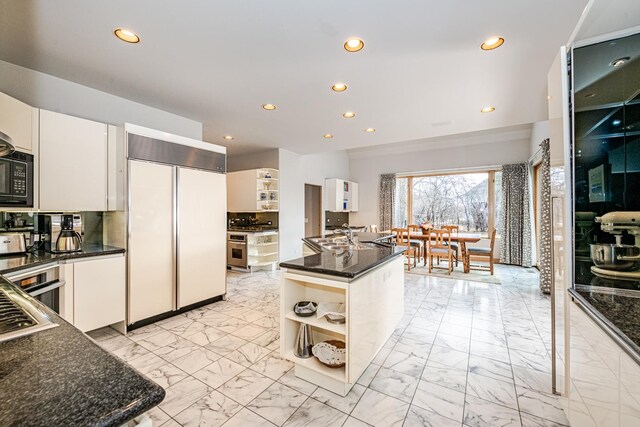 tiled dining room with a raised ceiling