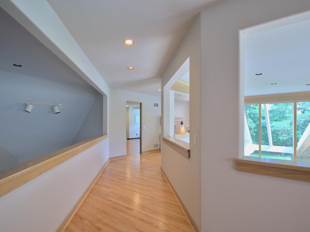 office area featuring built in desk and light hardwood / wood-style flooring