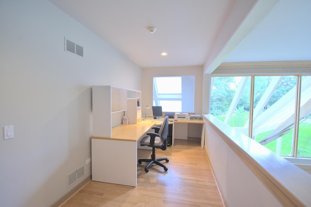 office area with light hardwood / wood-style floors