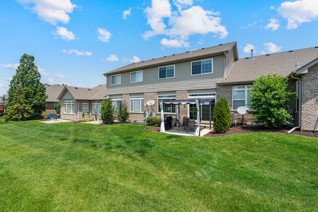 19154 Crescent Dr, Mokena, IL 60448 - rear view of house featuring a patio area, brick siding, and a lawn