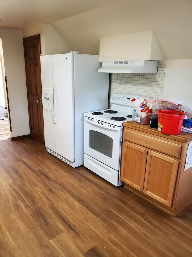 kitchen featuring wall chimney range hood, white appliances, and dark wood-type flooring