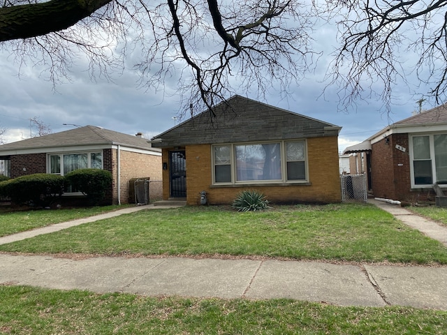 bungalow-style house with a front yard