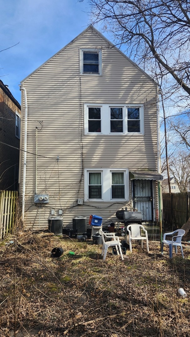 rear view of house with central air condition unit