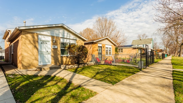 bungalow-style house featuring a front yard