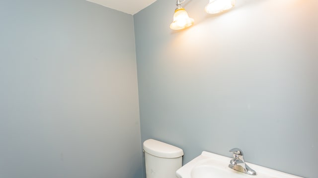 bathroom with toilet and sink